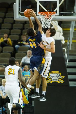 NKU player Cole Murray jumps up to block a North Carolina A&T players shot during the first half of NKU's