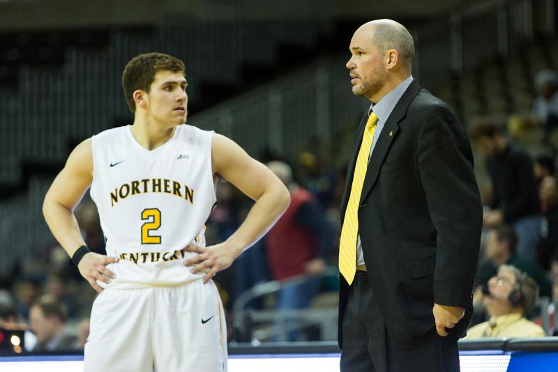 NKU Head Coach Dave Bezold talks to Tayler Persons (2) during the second half of NKU's 68-55 win. NKU defeated North Carolina A&T 68-55 in their home opener on Wednesday, Nov. 19, 2014 at the Bank of Kentucky Center.