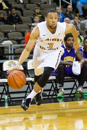 NKU junior Tyler White drives to the basket during NKU's 98-48 win over Ohio Mid-Western. NKU defeated Ohio Mid-Western 98-48 at The Bank of Kentucky Center on Nov. 22, 2014.