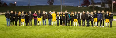 NKU seniors celebrate their last home game with their families. NKU defeated Stetson 1-0 in double overtime at NKU Soccer Stadium on Saturday, Nov. 1, 2014.