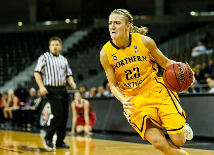 Kelley Wiegman dribbles the ball towards the basket during the 2013-14 season.