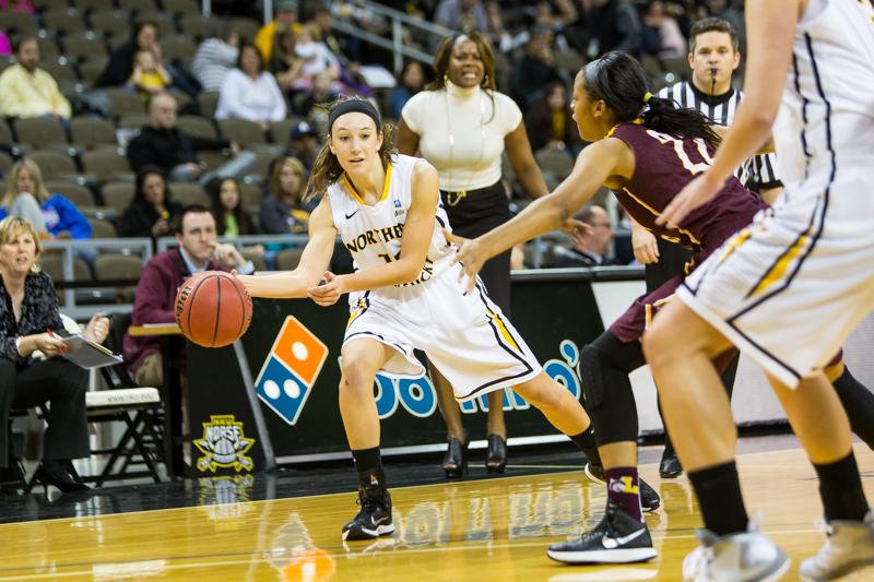 NKU junior Christine Roush passes the ball to a teammate during NKUs 38-45 loss to Loyola (Chicago). NKU lost to Loyola (Chicago) 35-45 at The Bank of Kentucky Center on Nov. 22, 2014.