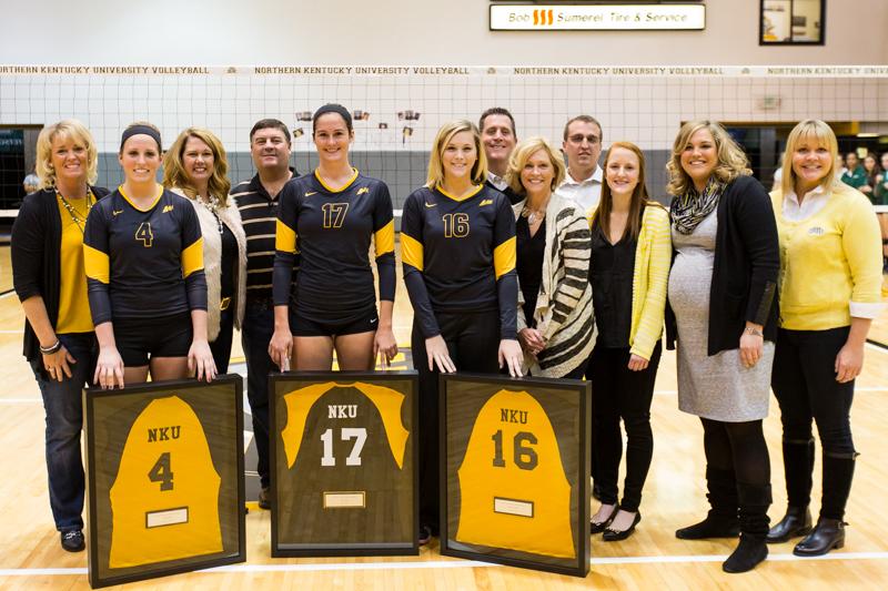 NKU+seniors%2C+Kiersten+Ham+%284%29%2C+Jenna+Ruble+%2817%29+and+Megan+Wanstrath+%2816%29++celebrate+their+Senior+Day+with+their+families+and+coaches.+NKU+defeated+USC+Upstate+3-1+on+Saturday%2C+Nov.+15%2C+2014+in+Regents+Hall+on+NKU+campus.