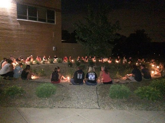 The night of Ben’s visitation, his closest family and friends sit together at his high school to share memories with each other and light a candle in Ben’s memory.