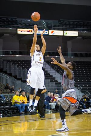 NKU player Tyler White shoots the ball against UT Martin in the second half of NKU's 56-71 loss. NKU lost to UT Martin 56-71 at The Bank of Kentucky Center on December 3, 2014.