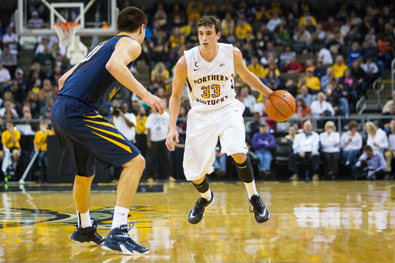 NKU mens basketball player Anthony Monaco faces a defender during the first half of NKUs 42-67 loss to West Virginia University. NKU was defeated by West Virginia University 42-67 at The Bank of Kentucky Center on Sunday, Dec. 7, 2014.