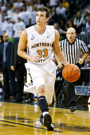 NKU men's basketball player Anthony Monaco dribbles towards the hoop during the second half of NKU's 42-67 loss to West Virginia University. NKU was defeated by West Virginia University 42-67 at The Bank of Kentucky Center on Sunday, Dec. 7, 2014.