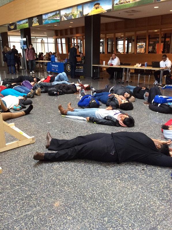 Students take part in die in against police brutality. 