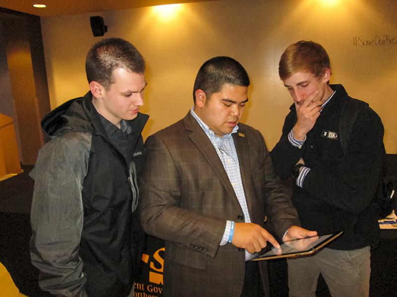 SGA President John Jose shows students how to sign the petition to #SaveOurRec. Jose held a forum Friday, Jan. 23, to discuss recent news of NKUs outsourcing of management for the Campus Recreation Center.