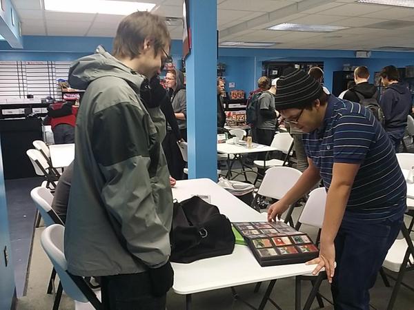 Dan Gerhardt (left) and Tony Miorano (right) trade cards in between rounds.