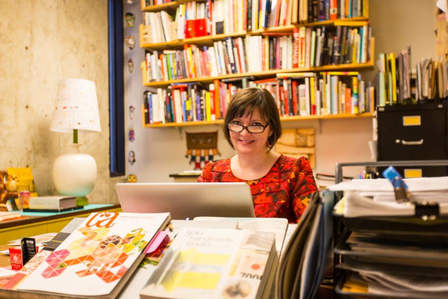 Julie Mader-Meersman sits in her colorful office. Her office is the fourth office in The Northerners Top Offices.