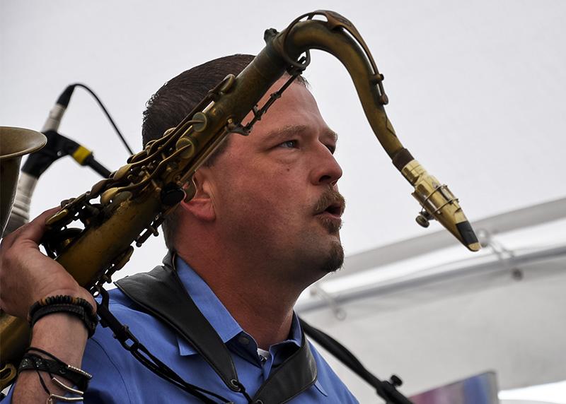 Hogg started playing saxophone after originally wanting to play drums. 