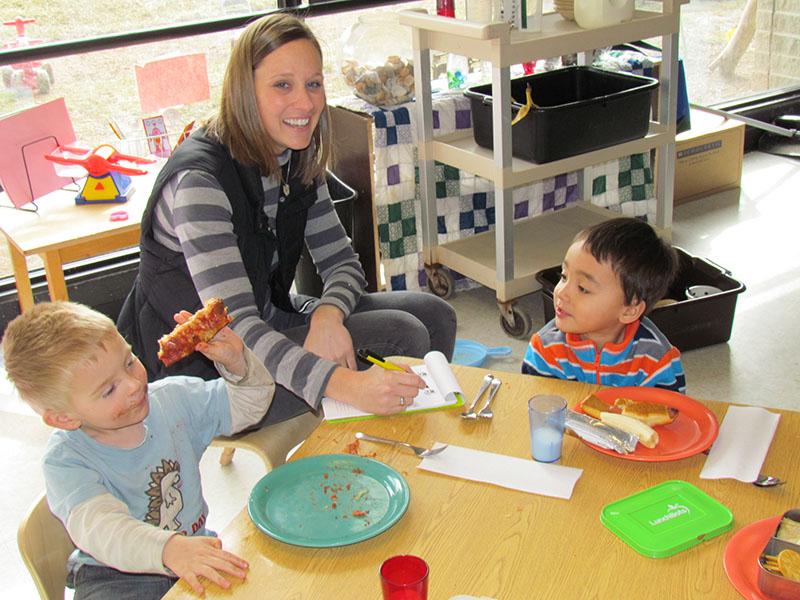 Audrey Wilson works with some of the students at the Early Childhood Center. 