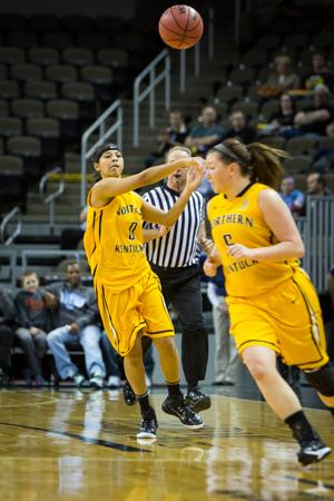 NKU guard Shar'Rae Davis passes the ball to a teammate in NKU's victory over Lipscomb. NKU defeated Lipscomb 64-57 at The Bank of Kentucky Center on Saturday, Feb. 7, 2015.