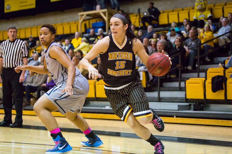 NKU player Sarah Kinch drives to the basket during NKU Womens Basketball Throwback game in Regents Hall. NKU defeated North Florida 67-29 in Regents Hall on Saturday, Feb. 21, 2015.