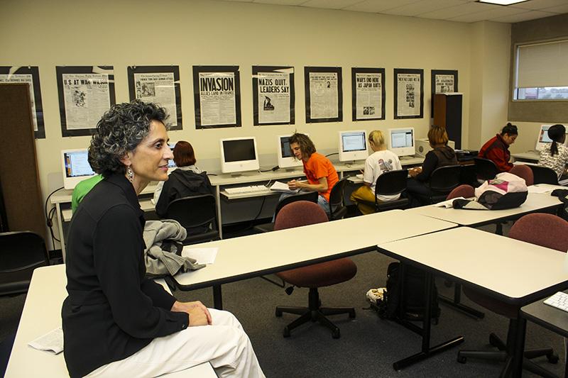 Mary Cupito delivering a lecture. She was a beloved professor and member of the journalism department. 