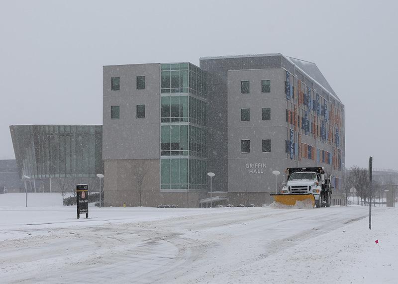 Snow plow trucks work to clear roadways on campus. NKU was closed Monday, Feb. 16 due to inclement weather.