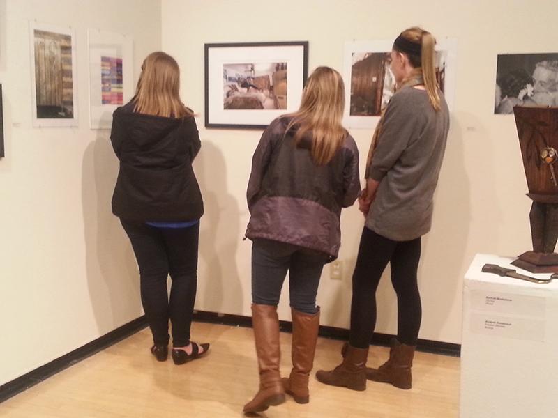 Students browse the gallery. 