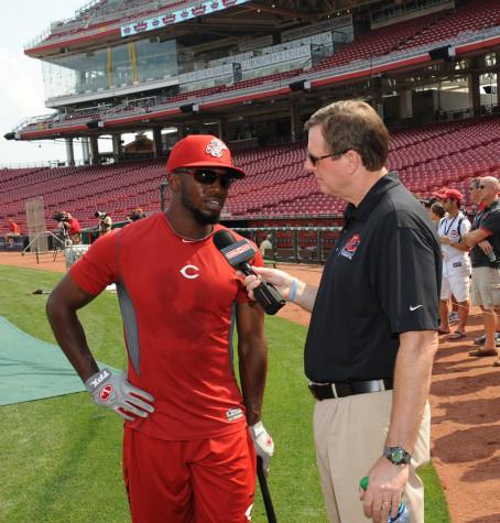 NKU and Cincinnati Reds broadcaster Jim Kelch talks to a Reds player before a game. Kelch is the "Voice of the Norse" for NKU men's basketball radio broadcasts. Photo provided by the Cincinnati Reds.