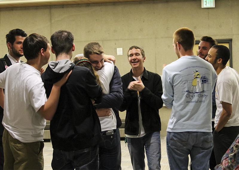 Kat Hahnel and Will Weber, President and Vice President elect, embrace in a hug surrounded by friends after the announcement of their win. The duo won with 565 votes.