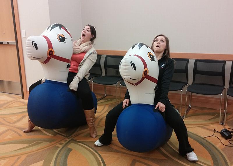 Students Clare Lees and Taylor Klumb​ having fun at the Student Union festival. The festival was Derby themed this semester. 