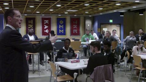 President Mearns speaks to students at Monday's town hall forum. The Rec Center, Health Innovations Center, Peter Gitau's resignation and the national search for a new head basketball coach were the topics of discussion.