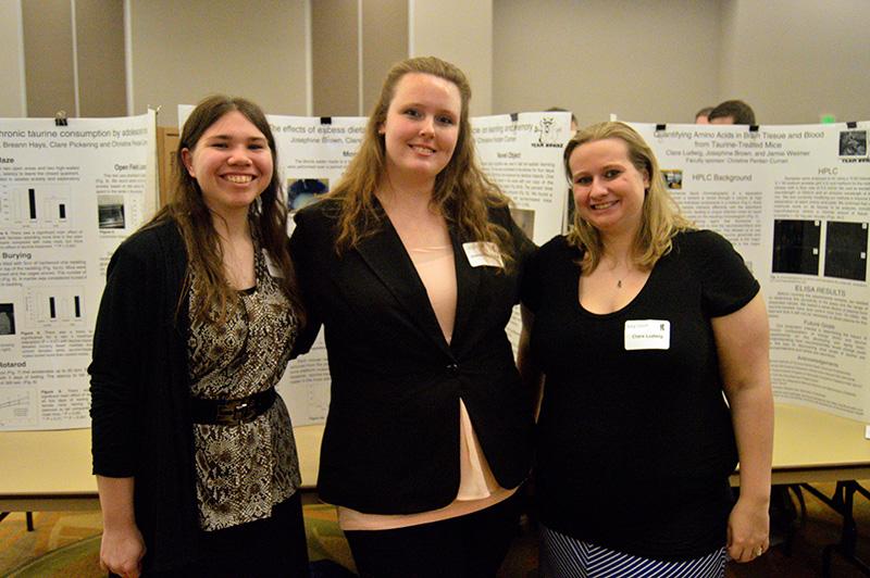Biological science students (from left to right) Jamie Weimer, Josephine Brown and Clare Ludwig stand in front of their poster presentation at NKUs Celebration on Wednesday. The three studied the effects of the chemical taurine on adolescent mice.  