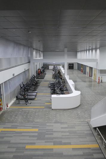 As you first enter the rec area there is a long section with workout machines in it. The space can be looked down into from a study area and the indoor track one it is open.