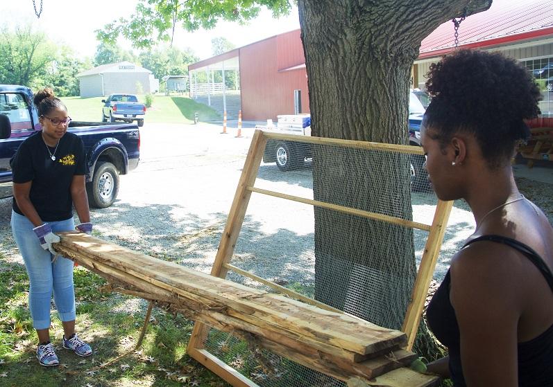 Two students working together to better their community. They both took part in the annual Day of Service.