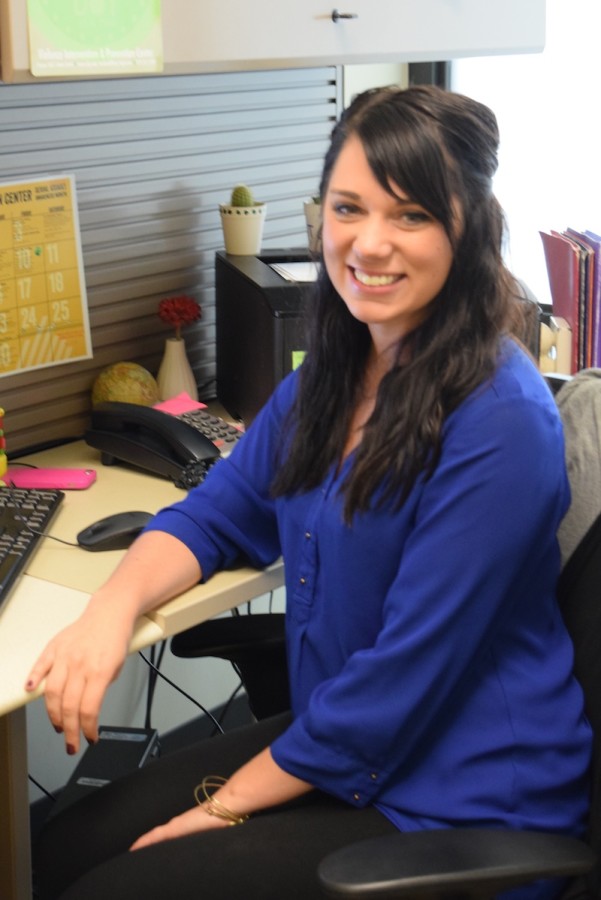 Gabby Molony sits at her desk. Molony is the Norse Violence Prevention coordinator. 