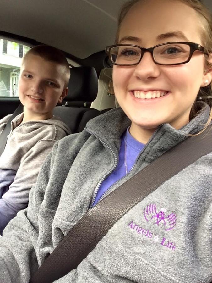 Justice with Jordan on their way to Skyzone (an indoor trampoline place). She goes with Jordan there as much as she can because he loves it.