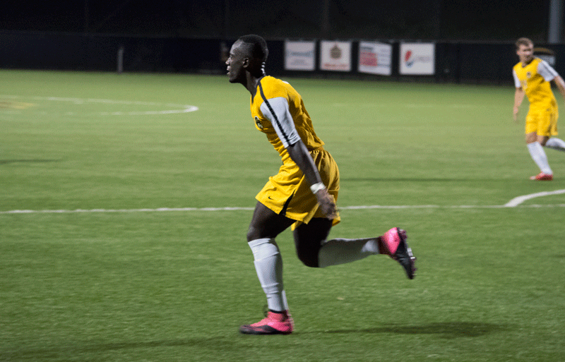 Yaw Addai celebrates the game-tying goal scored in the 88th minute Wednesday night at NKU Soccer Stadium. Addai's goal would help NKu earn a 2-2 draw against the Jaguars.