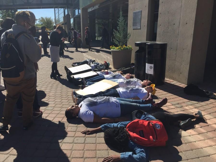 Students take part in a die-in during the silent protest bringing awareness to school shootings and gun violence. The protest was organized by Students for Social Change.