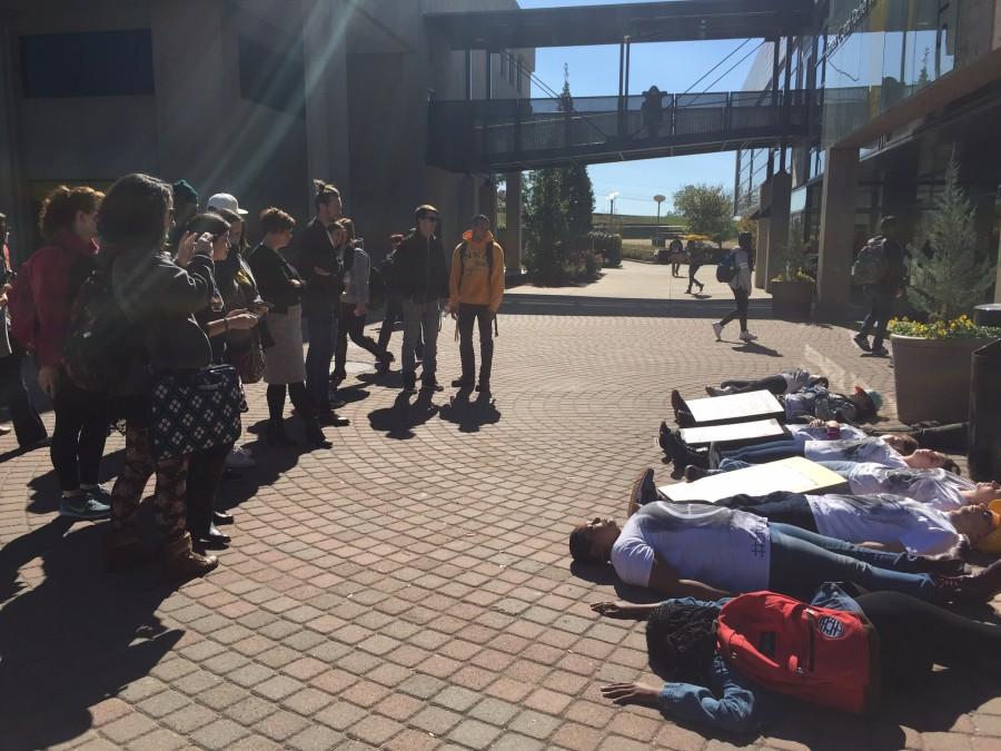 Students take part in a die-in during the silent protest bringing awareness to school shootings and gun violence. The protest was organized by Students for Social Change.