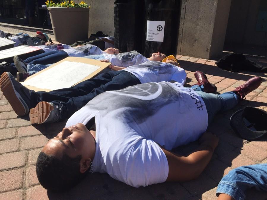 Students take part in a die-in during the silent protest bringing awareness to school shootings and gun violence. The protest was organized by Students for Social Change.