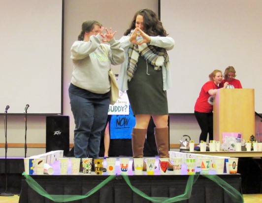 The theme for this year second fashion show was a latte love. A buddy flashed a heart to represent this. 