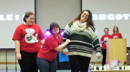 Rachel Galatis(left) buddy, Kelsey(middle) wore
 an AOPi bid day shirt and strutted to Disney’s “Snow White” iconic song “High Ho.”