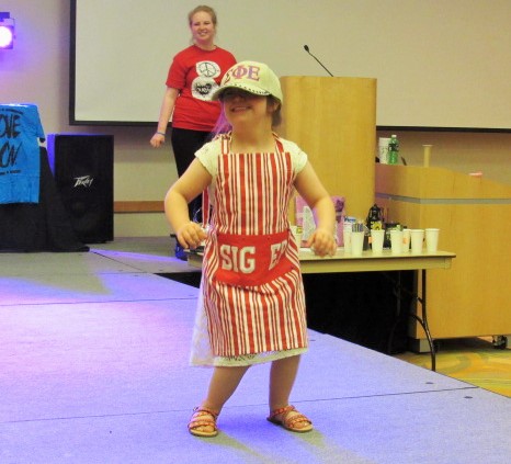 Dressed
 as a barista, 5-year-old Ellie Hammond was sponsored by Sigma Phi Epsilon-KY Eta. She flashed her 100 watt smile as she reached the end of the runway, dancing to stanky leg and watch me whip