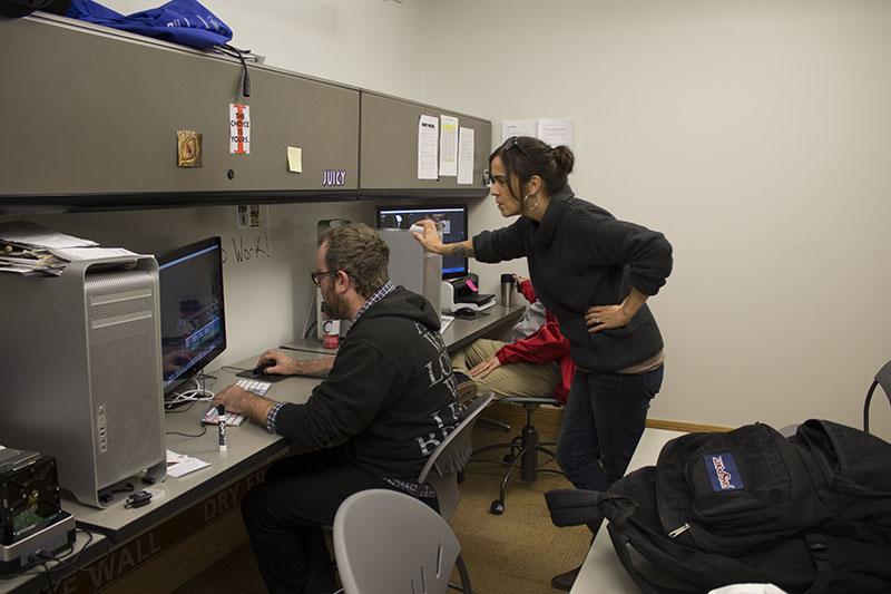 Sara Drabik works with student Holland Rains in the Norse Media office.