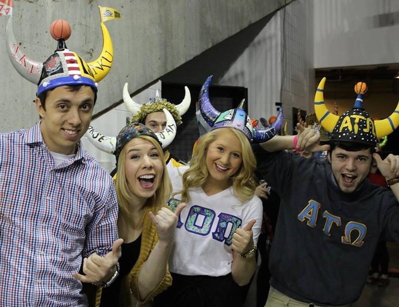 Students participate in the 2015 Homecoming helmet decorating competition. This is organized by the Activities Programming Board and the Homecoming Committee. 