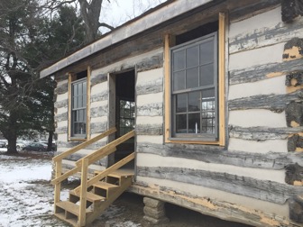 New window frames have been put into the cabin. Candles were put in the windows to pull the cabin together.