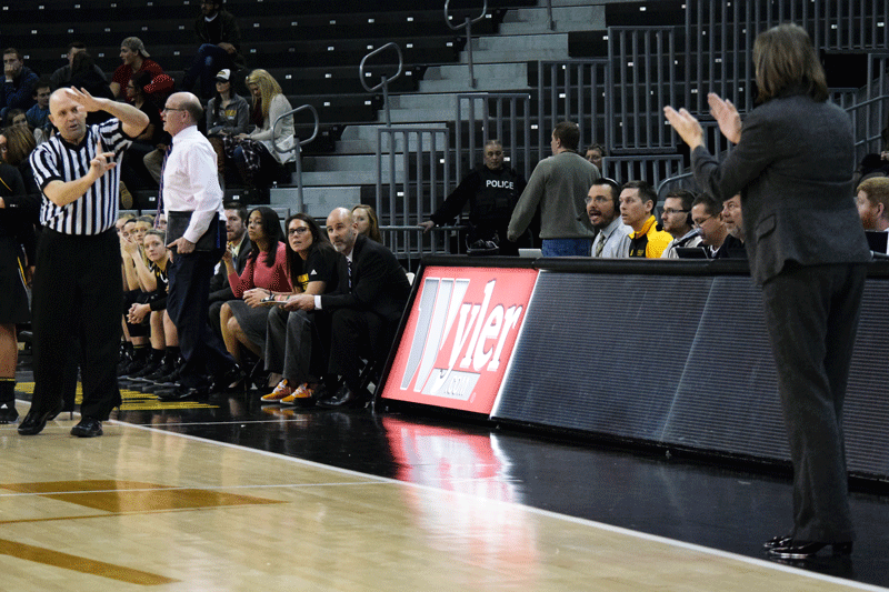 NKU Head Coach Dawn Plitzuweit (right) is assessed a technical foul during Saturday's game against Milwaukee.