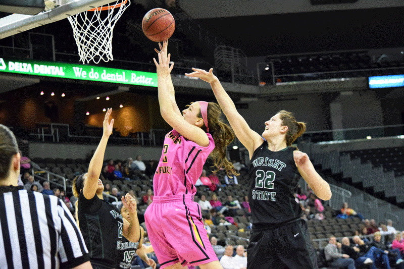 Courtney Roush (12) gets a shot up around 6-5 Richelle van der Keijl (22) during Saturdays NKU game against Wright State.