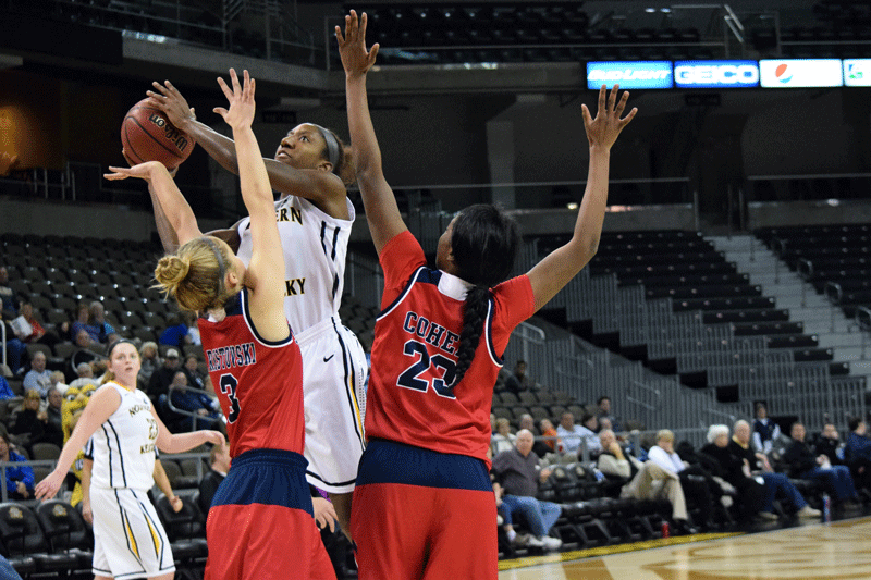 Rebecca Lyttle (3) fights through two defenders Thursday in NKU's win over Detroit.