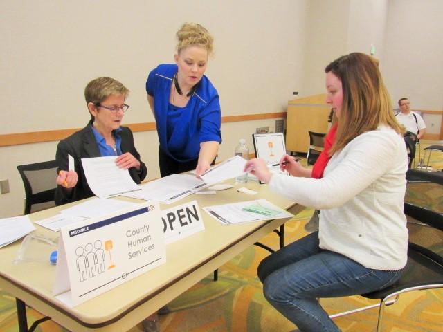 At the county human services station, a participant learns how college students deal with living in poverty. 