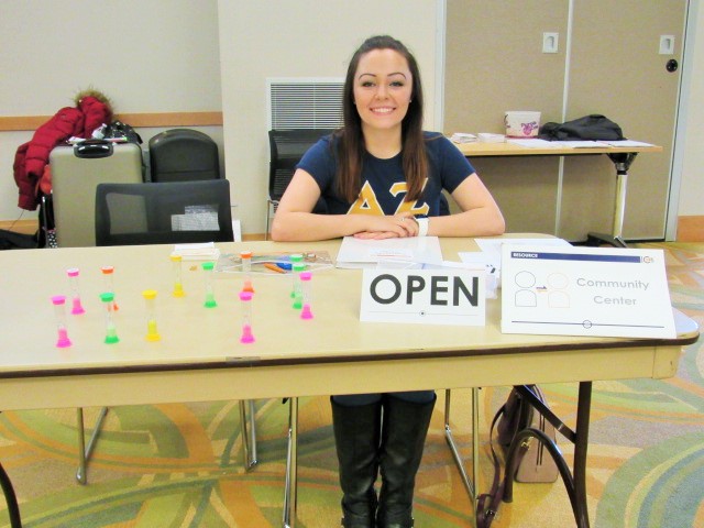 Madeline Stine volunteers to work the community center station. Stine predicted Project COPE would be a powerful experience. 