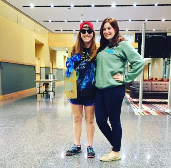 Taylor Berns(left) places first in Phi Sig Open Mic Night for her clever and speedy rapping.
