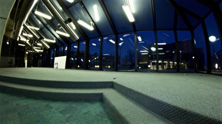 An empty, dimly lit lobby located in Founders Hall. 