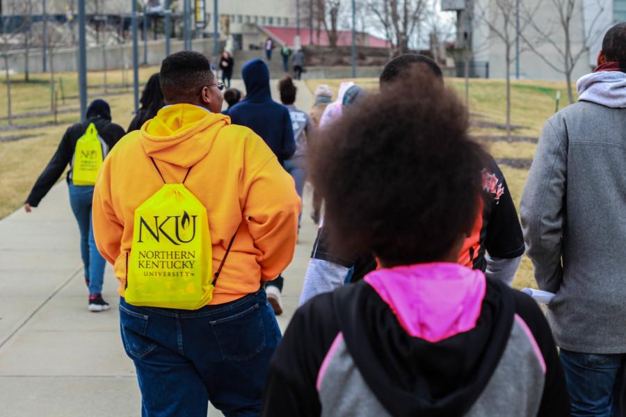 NKU student tour guide Faith Pearce talks to Withrow University High School eighth graders about NKU dormitories. 