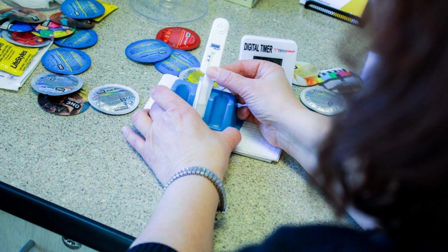 Campus nurse Michele Kay prepares the HIV test before administering it to a student. The test is free of charge and is offered through NKU. 